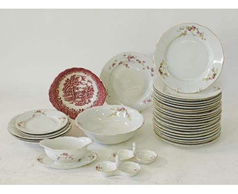 A Czechoslovakian white porcelain part dinner service decorated with pink roses. Comprising a large salad bowl, a sauce boat,