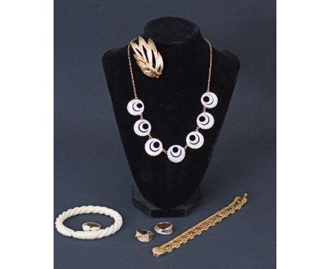 A collection of costume jewelry together with an ivory bangle and a gold ring mounted with ivory. The ivory bangle and ring 3