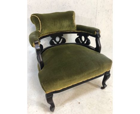 Late 19th Century armchair, on ceramic castors, with green velvet upholstery