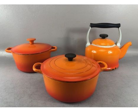 Collection of enamel cookware to include 'Volcanic' coloured Le Creuset kettle, and a lidded casserole 