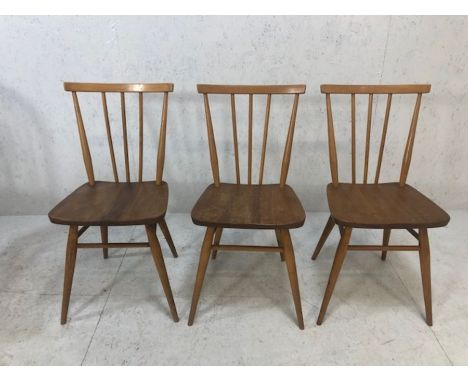 Three Ercol style dining chairs BS 1960 stamped, splayed spindle backs and legs 