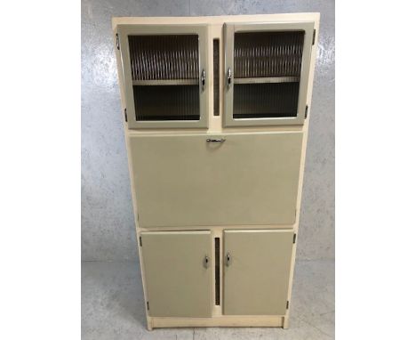 Vintage wooden larder cupboard with fall-front, revealing internal drawers and shelves, enamel work surface, glazed cupboards