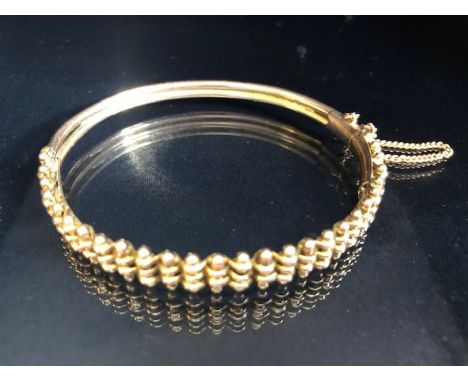 9ct Rose Gold Bangle decorated with Gold bars with good catch and safety chain approx 10g