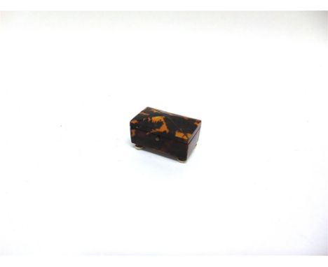 A TORTOISESHELL SNUFF BOX  of rectangular form, the hinged lid with shaped top on four turned feet, 51mm wide 30mm deep 31mm 