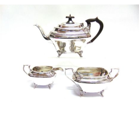 A SILVER THREE PIECE SILVER MATCHED TEA SERVICE by Deakin & Deakin, Sheffield 1926, and J.W. & S, Sheffield 1933, of rectangu