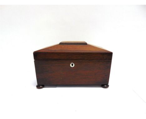 AN EARLY VICTORIAN ROSEWOOD TEA CADDY  of sarcophagus form, the interior with twin compartments and mixing bowl, 28cm wide 15