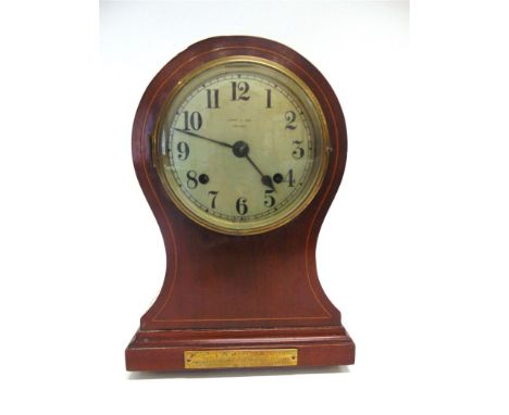 AN EDWARDIAN INLAID MAHOGANY BALLOON CASED MANTLE CLOCK, with 8-day movement, the silvered dial with Arabic numerals inscribe