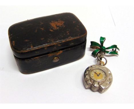 A FOB WATCH OF RIDING INTEREST the case in the form of a horse shoe, with some enamel decoration to the reverse, on an enamel