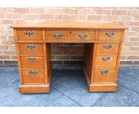 A LIGHT OAK TWIN PEDESTAL DESK,  106.5cm wide 59cm deep 74cm high