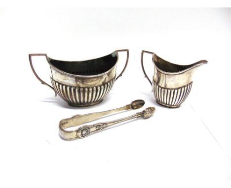 A FOUR PIECE MATCHED LATE VICTORIAN SILVER TEA AND COFFEE SERVICE by Deakin & Deakin, Sheffield 1891-92, of oval gadrooned fo