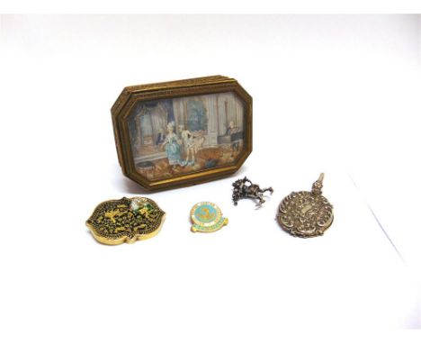 AN INDIAN BROOCH a plated aide memoire for a chatelaine; a plated figural brooch; a committee badge for the British Empire Ca