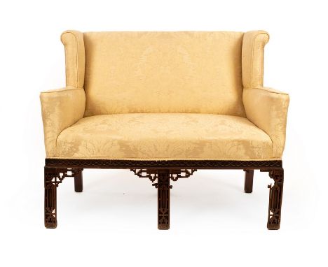 A two-seater sofa of Chinese Chippendale design with blind fret decoration, 130cm wide CONDITION REPORT: Condition informatio