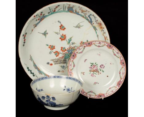 A Chinese Kakiemon-style dish with later decoration, 18th Century, depicting birds flying among flowers with garden scenes on