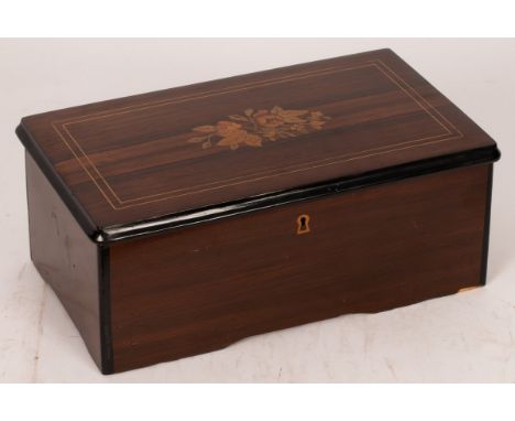 A 19th Century Ducommun Girod musical box playing six airs with a fifty-seven tooth 15cm comb, in a rosewood case with inlaid