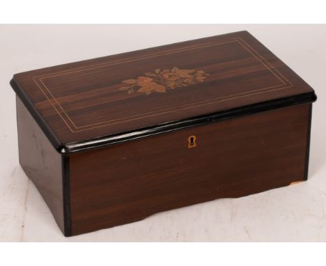 A 19th Century Ducommun Girod musical box playing six airs with a fifty-seven tooth 15cm comb, in a rosewood case with inlaid