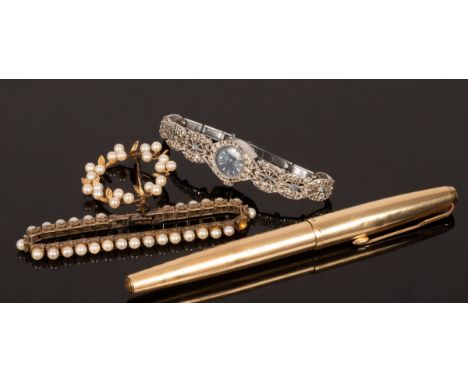 A 14K gold circular brooch, decorated leaves and pearls, approximately 5g gross, a Parker fountain pen, a silver set pearl br