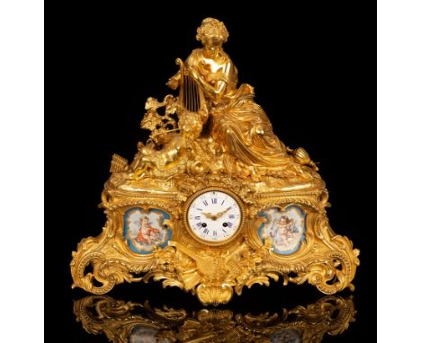 A gilt metal and porcelain mounted mantel clock, the white enamel dial with blue numerals, flanked by Sèvres style panels dep