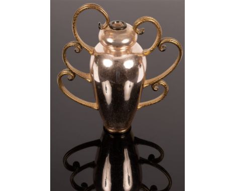 A silvered glass trophy vase supplied by Halcyon gallery, of inverted baluster form with six stylised scrolled handles, decor