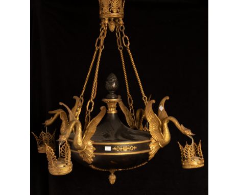 An Empire style gilt metal mounted electrolier with four swans each suspending an acanthus coronet, with opaque glass flame l