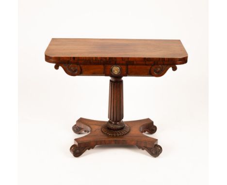A Regency rosewood card table with scrolls to the frieze, on a reeded tapered column and flat quadruple base, 88cm wide CONDI