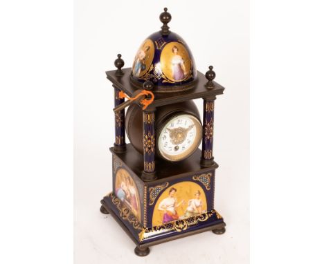 A late 19th Century mantel clock, the dome top case with Vienna porcelain panels painted maidens in gilded backgrounds with p