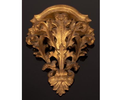 A carved gilt wood wall bracket and a gilt metal three-branch table light CONDITION REPORT: Condition information is not usua