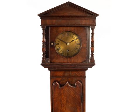 A mahogany Grandmother clock, the hood with triangular pediment, fitted a brass dial with chapter ring, the movement with anc