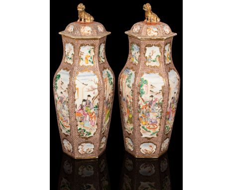 A pair of Chinese export famille rose vases, circa 1780, of hexagonal form decorated with panels depicting a noble family at 