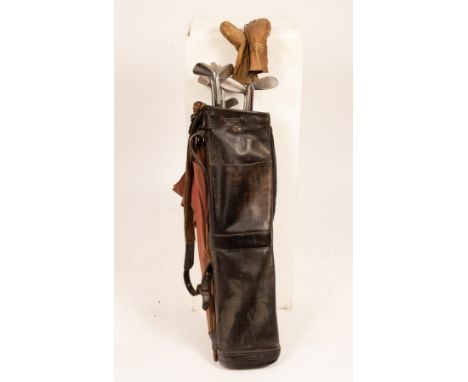 A set of Laurie Ayton Jnr. golf clubs, two woods, seven irons and an odd putter contained in original case/Note: These clubs 