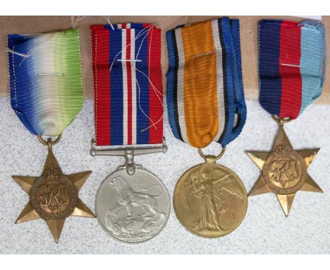 A WWI Victory medal to 18028 SJT. MJ Smith, Glouc R and a group of three WWII medals comprising the 1939-45 Star, The Atlanti