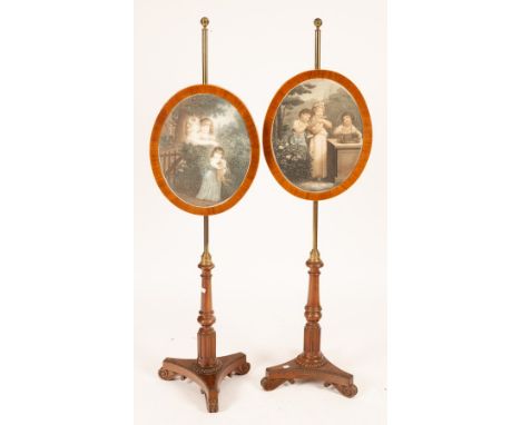 A pair of George IV rosewood and mahogany pole screens, attributed to Gillows, one rosewood and one mahogany, each with a gil
