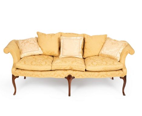 A George III mahogany framed upholstered sofa, in cream floral damask, the serpentine back with outscrolled arms, serpentine 