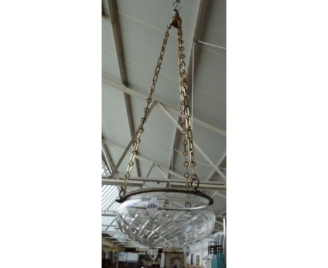 A cut glass ceiling light of shallow bowl form, hung from a gilt bronze circlet and brass suspension chains, 34cm diameter.