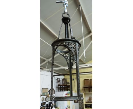 An Edgar Brandt style bronze lantern of Arts and Crafts style, 20th century, the triform supports moulded and cast with snail