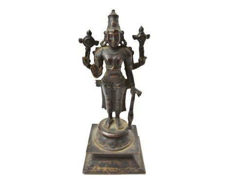 A Tamil Nadu bronze figure of Vishnu, South India, 18th century, standing with right hand in abhaya mudra, holding a discus, 