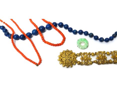 A single row necklace of graduated coral beads, on a gilt metal clasp, another single row of imitation coral beads, a single 