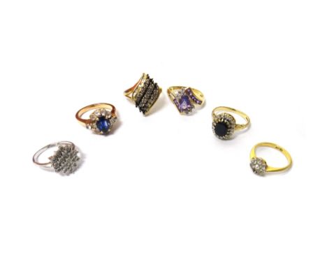 A 9ct gold, sapphire and diamond set oval cluster ring, a gold, oval cut sapphire and colourless gem set oval cluster ring, w