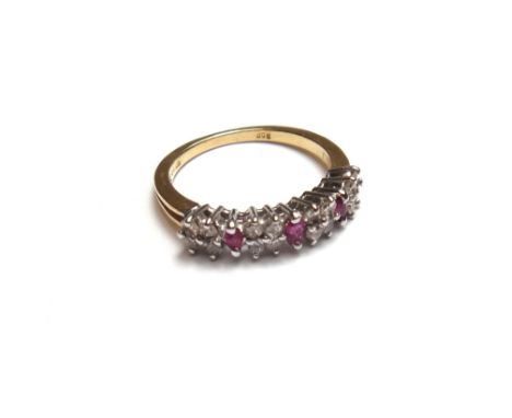 An 18ct gold, ruby and diamond set half hoop ring, mounted with four groups of four circular cut diamonds and with three marq