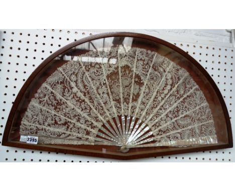 A Brussels lace fan, late 19th/early 20th century, with all over foliate embroidered decoration and mother of pearl sticks, m