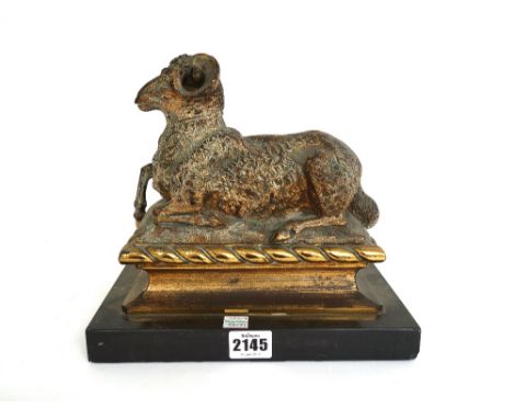 A gilt bronze model of a recumbent ram, late 19th/early 20th century, modelled atop a polished black slate plinth, 20.5cm hig