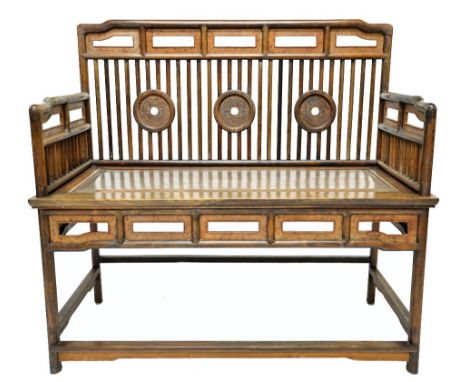 A late 19th /early 20th century Chinese stick back bench with triple roundel decoration and solid seat on turned supports, pr