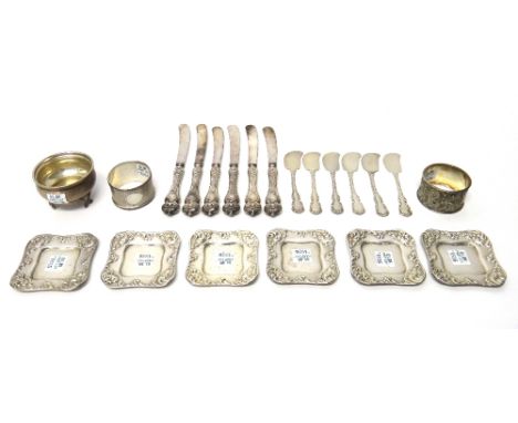 A set of six Sterling butter knives, a set of six shaped square Sterling butter dishes, (the liners lacking), a silver napkin