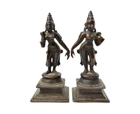 A pair of bronze figures of Sri Devi and Bhu-Devi,consorts of Vishnu,  South Indian, circa 17th century, both standing in tri