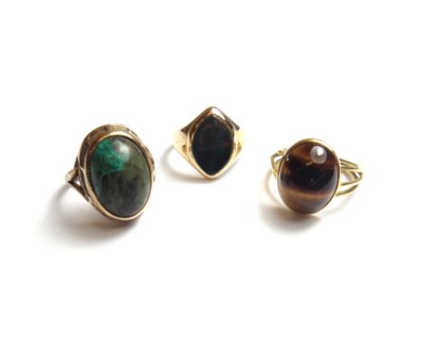 A gold and bloodstone set lozenge shaped signet ring, detailed 18 CT, a gold and oval turquoise set single stone ring, detail