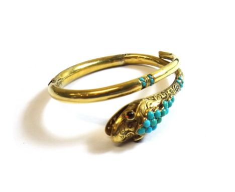 A Victorian gold and turquoise set sprung hinged bangle, designed as a coiled snake, the head mounted with circular turquoise