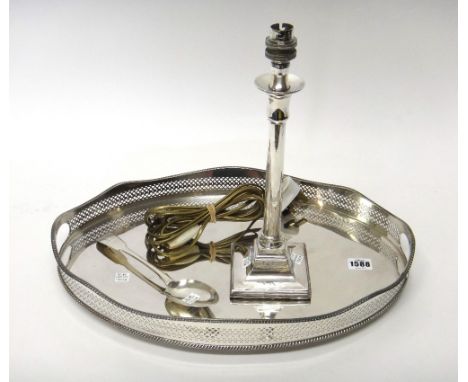 A silver fiddle pattern tablespoon, London 1818, weight 75 gms, a plated twin handled oval gallery tray, raised on four feet 