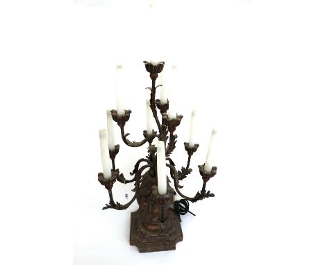 A painted carved wooden ten branch candelabrum table lamp, on a shaped, stepped square base, 72cm high.