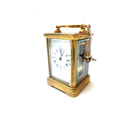 A gilt brass cased carriage clock, early 20th century, the white enamel dial detailed J. W. Benson, with a two train French m