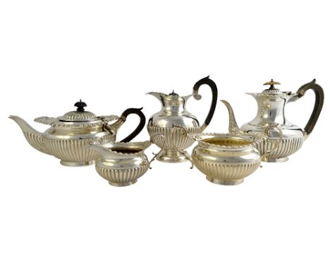 A silver five piece composite tea and coffee service, comprising; a teapot, London 1909, a coffee pot, London 1904, a hot wat