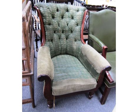 A William IV mahogany framed button back armchair, on lappet carved supports. 